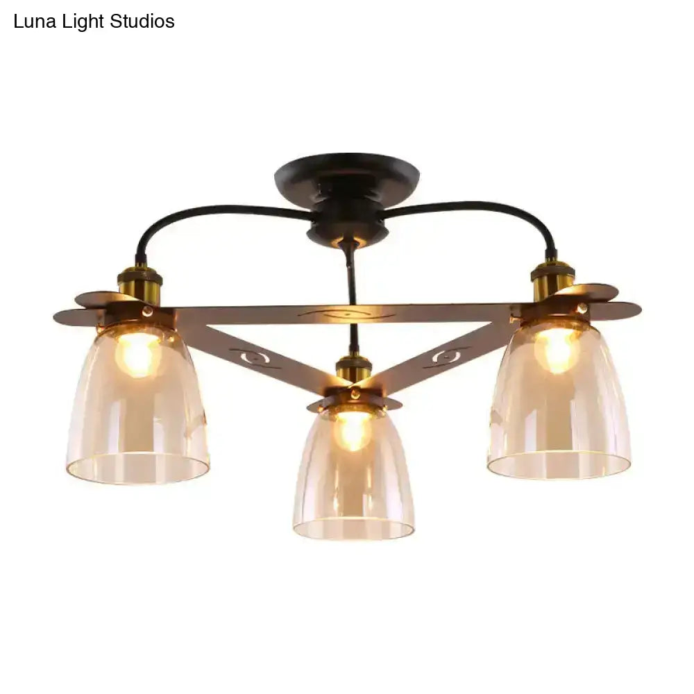 Bronze-finished ceiling lamp with three amber-tinted cognac glass bell shades in triangular frame for living room