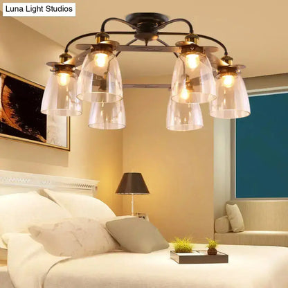 Black wrought iron ceiling lamp with five cognac glass bell shades and brass accents for living room decor
