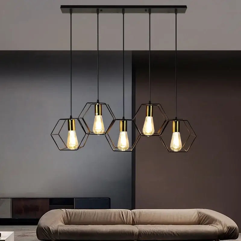 Modern black and brass hexagonal pendant light with filament bulbs featuring decorbites industrial led design for dining room