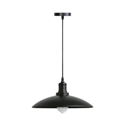 Industrial black and brass iron pendant light with a black matte dome shade and exposed bulb for kitchen lighting decorbites iron pendant