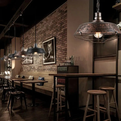 Industrial black and brass iron pendant light with dark weathered metal shade and exposed filament bulb for kitchen lighting