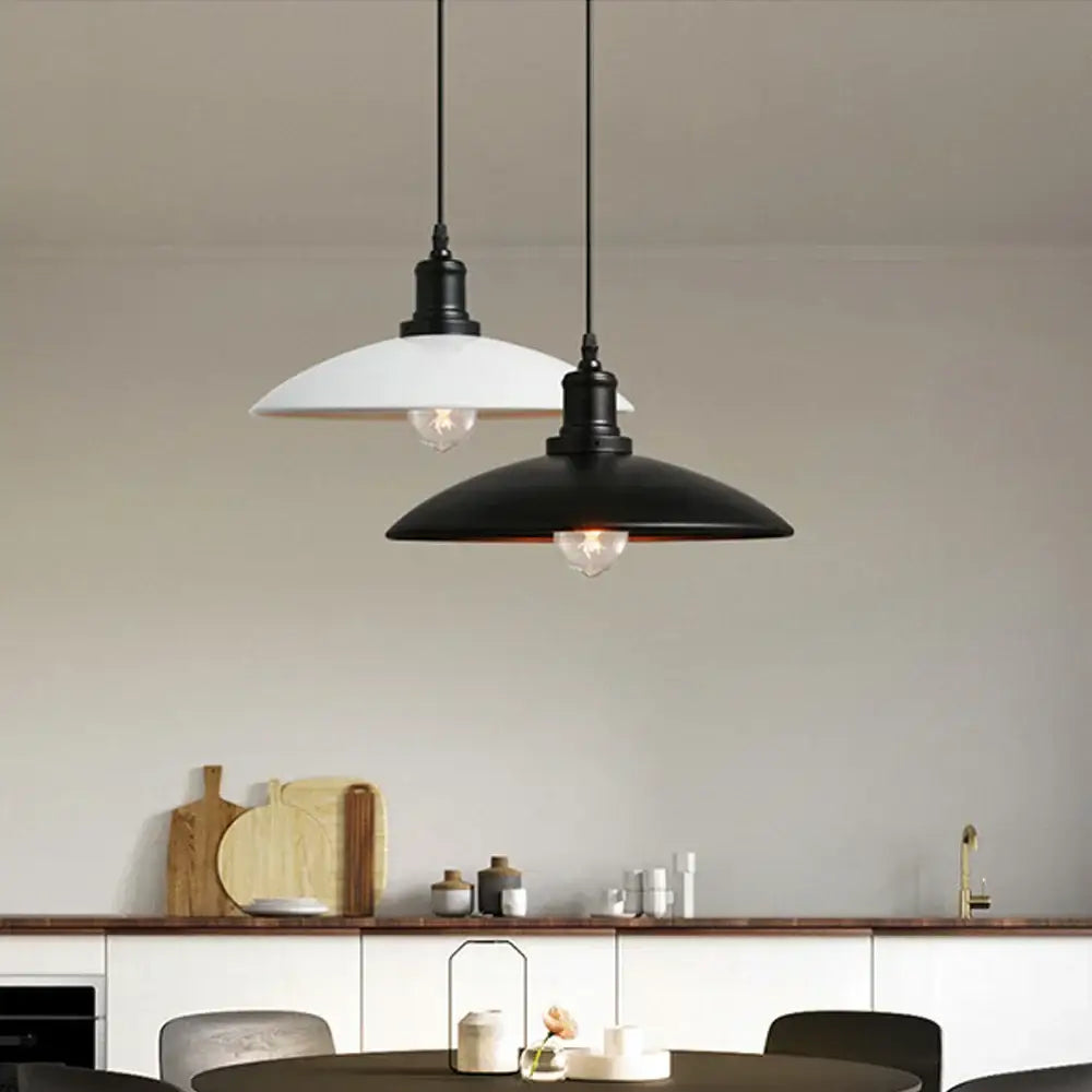 Two pendant lights with black metal fixtures and white and black enamel shades industrial iron pendant light kitchen decorbites