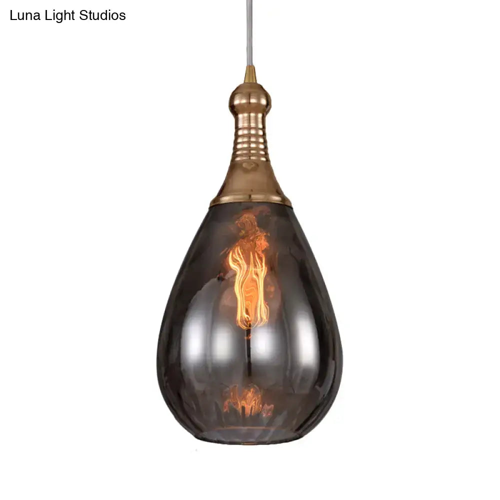 A daisy industrial black ceiling light with dark smoked glass teardrop shade and brass-finished metal top housing filament bulb