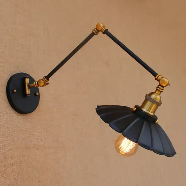 Industrial black and brass swing arm wall lamp with articulated arms and fluted shade for decorbites industrial swing arm use
