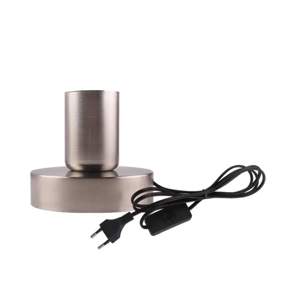 Modern brushed stainless steel desk lamp with cylindrical shade black power cord and industrial black bronze lamp base