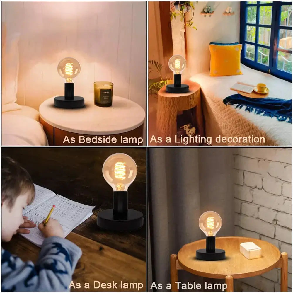 Industrial black and bronze desk lamp base with a clear glass bulb and edison-style filament for vintage bedroom use
