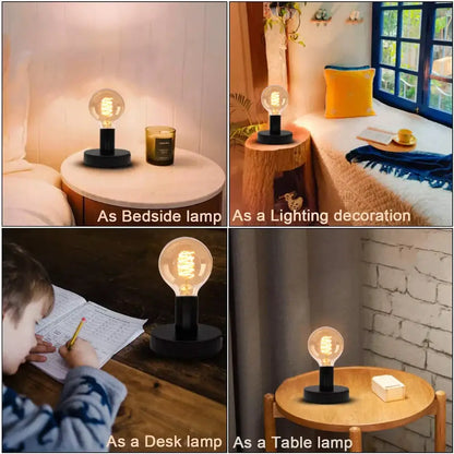 Industrial black and bronze desk lamp base with a clear glass bulb and edison-style filament for vintage bedroom use