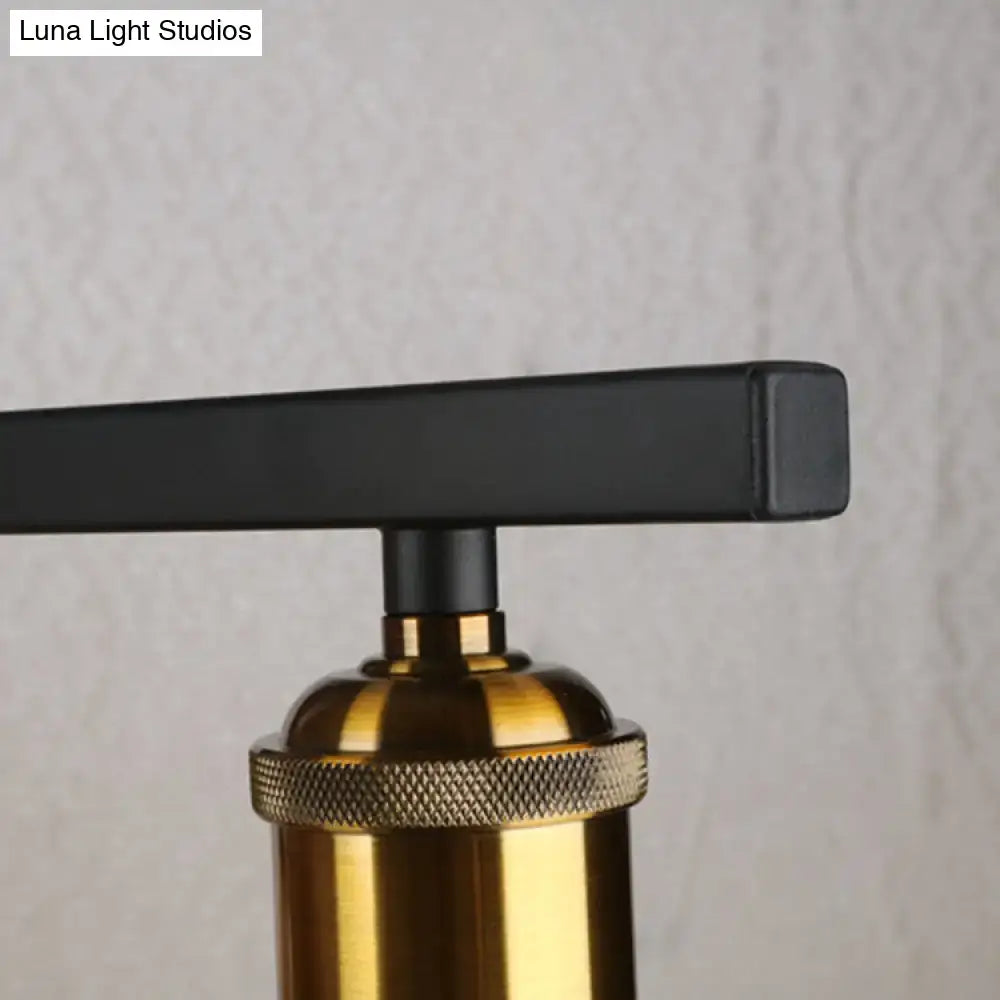 Industrial-style table lamp with matte black handle and brass knurled base shown with decorbites clear glass pendant light 110v-120v