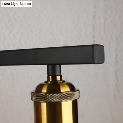 Industrial-style table lamp with matte black handle and brass knurled base shown with decorbites clear glass pendant light 110v-120v