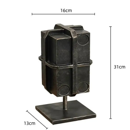 Industrial black geometric block binding metal bookends with dark metallic sculpture and circular cutouts for living room use