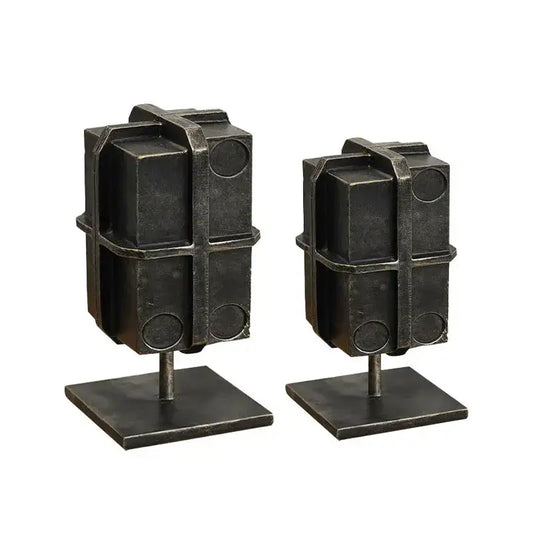 Industrial black geometric block binding metal bookends with rugged textured finish and circular cutouts for living room use