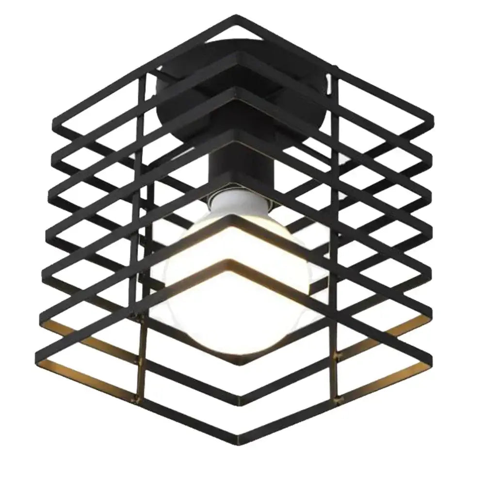 Industrial black geometric cage pendant light featuring a metal grid design and illuminated bulb for kitchen decorbites industrial vintage led