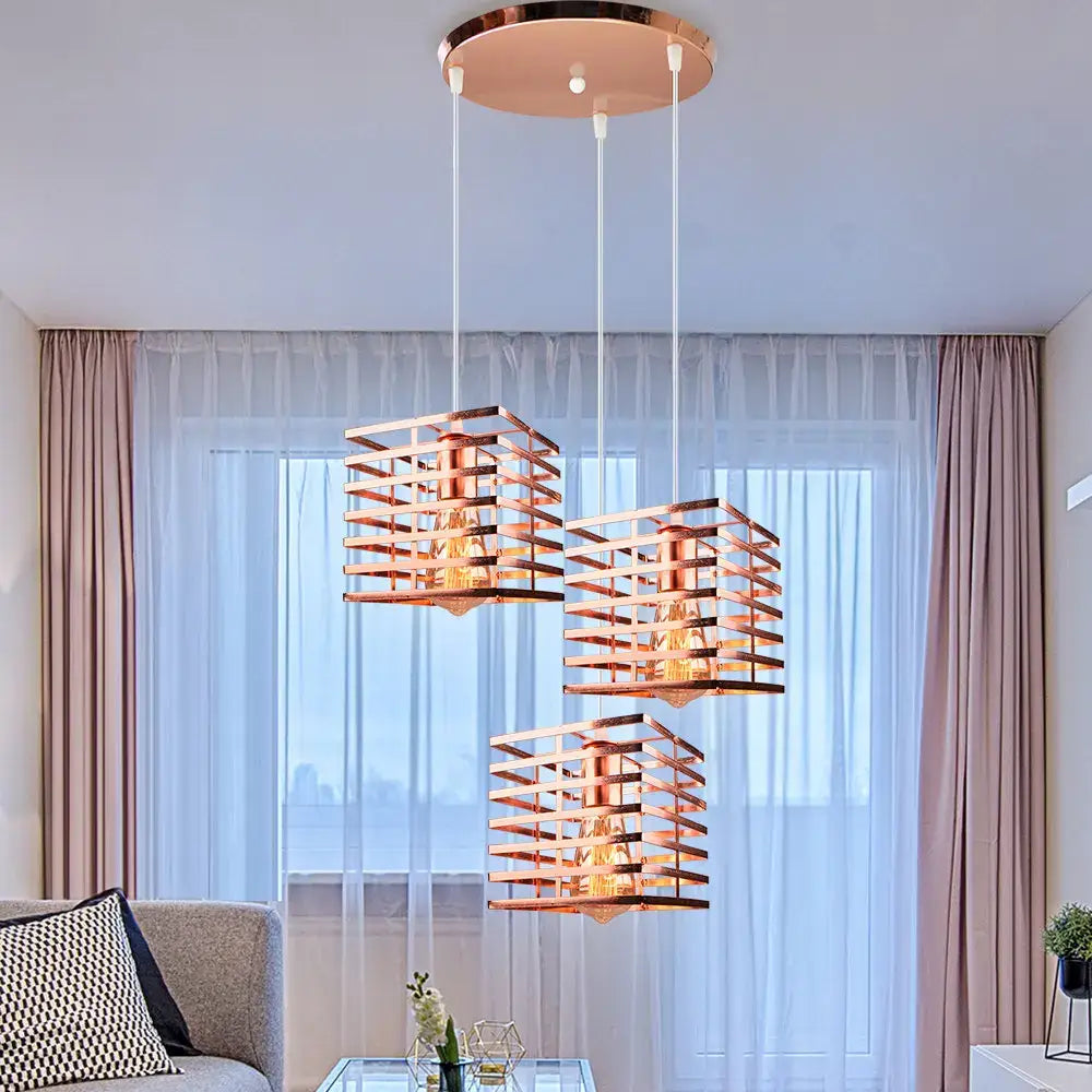 Three copper-toned geometric pendant lights with a modern grid design for industrial vintage led decorbites pendant light decor