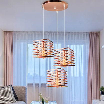 Three copper-toned geometric pendant lights with a modern grid design for industrial vintage led decorbites pendant light decor