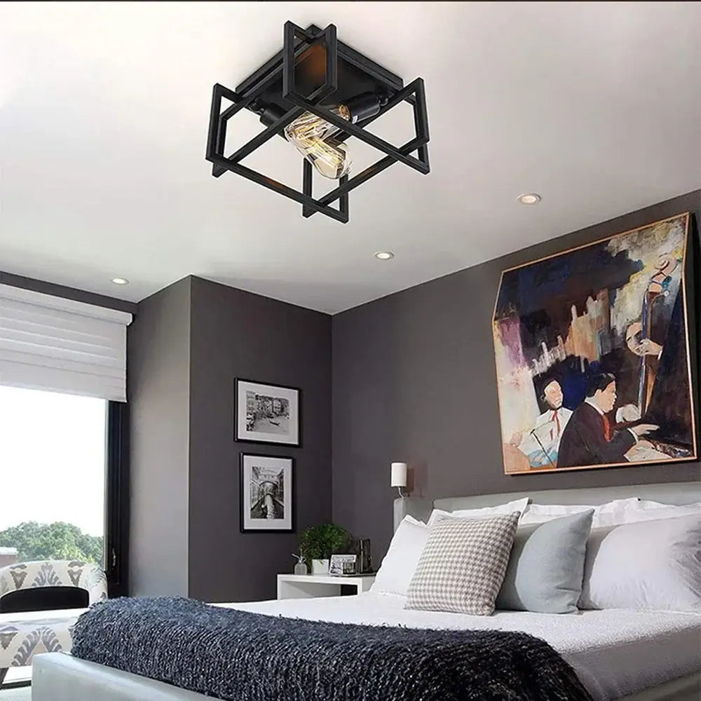 Industrial black geometric ceiling light fixture with exposed filament bulb ideal for kitchens and modern spaces