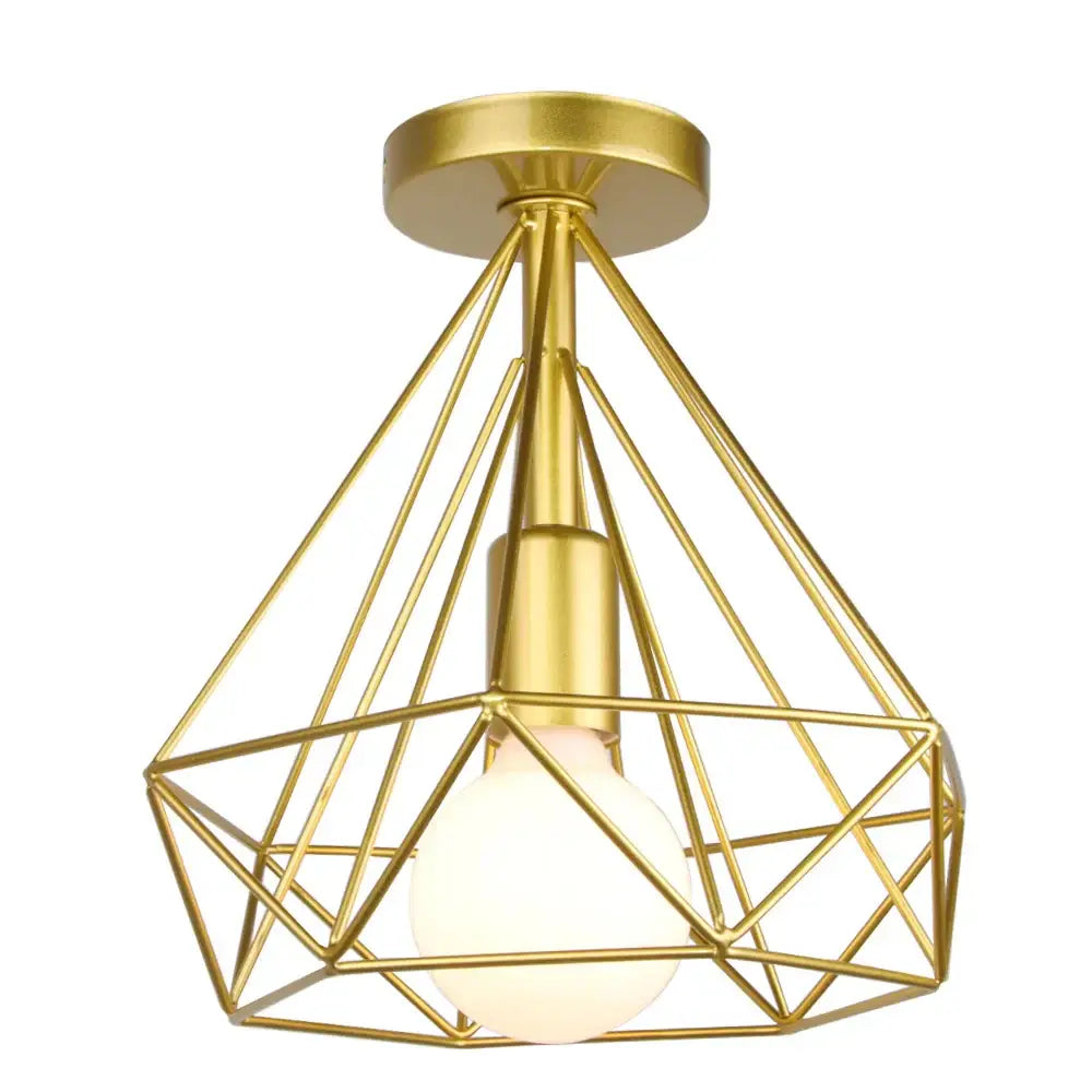 Gold-colored geometric wireframe pendant light with frosted bulb for dining room decorbites industrial led style
