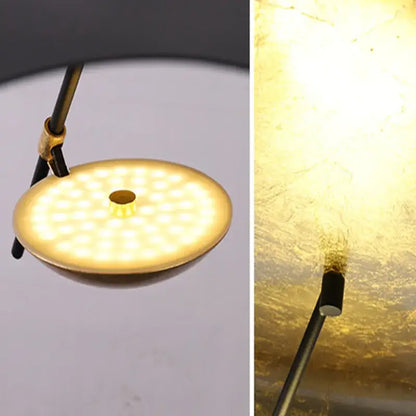 Gold-finished circular led desk lamp with matte black stem and brass clamp complementing decorbites lederam pendant decor
