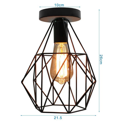 Industrial black iron cage chandelier ceiling light featuring a glowing amber filament bulb for kitchen decorbites iron cage decor