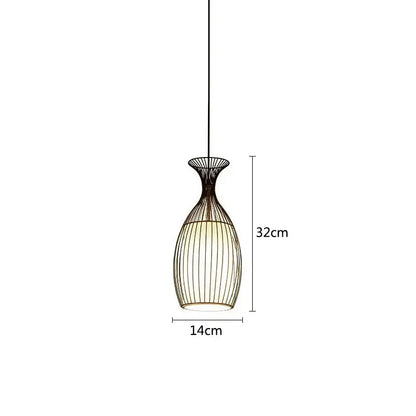 A sleek black iron cage pendant light with vase shape vertical ridges illuminated for dining room decorbites iron cage