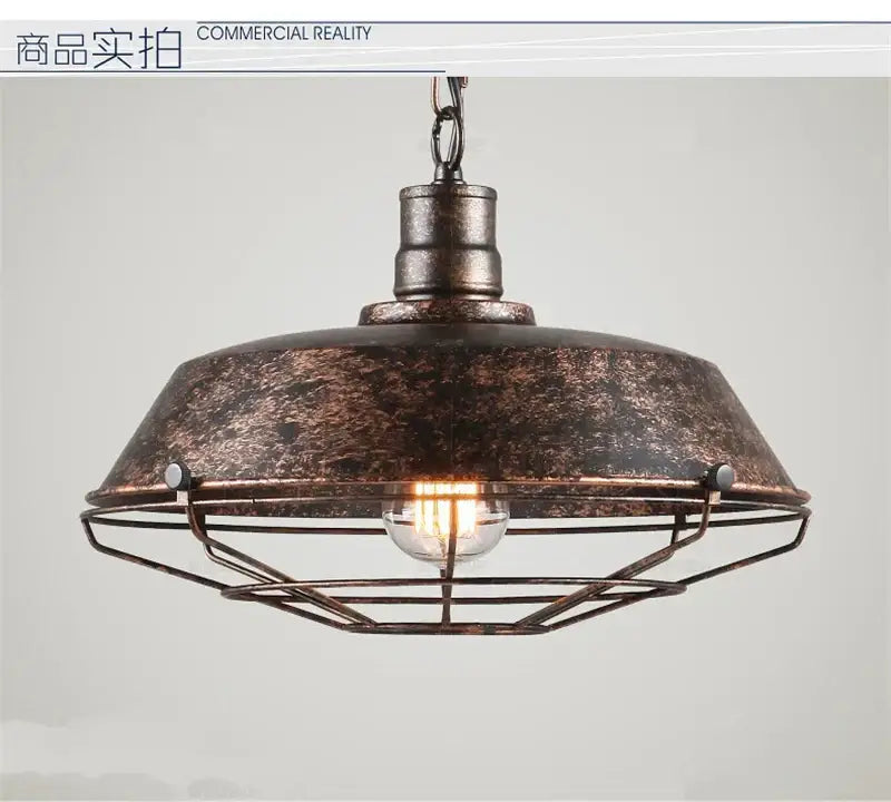 Industrial black iron pendant light with distressed bronze finish, domed metal shade, and wire cage for dining room decorbites iron pendant