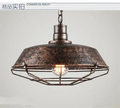 Industrial black iron pendant light with distressed bronze finish, domed metal shade, and wire cage for dining room decorbites iron pendant