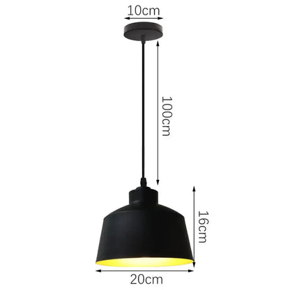 Black industrial iron pendant light with matte finish and warm yellow interior glow for kitchen decorbites industrial iron pendant lights