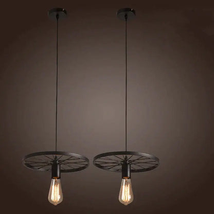 Two black industrial iron wheel chandelier pendant lights with vintage edison bulbs for dining room decorbites iron wheel