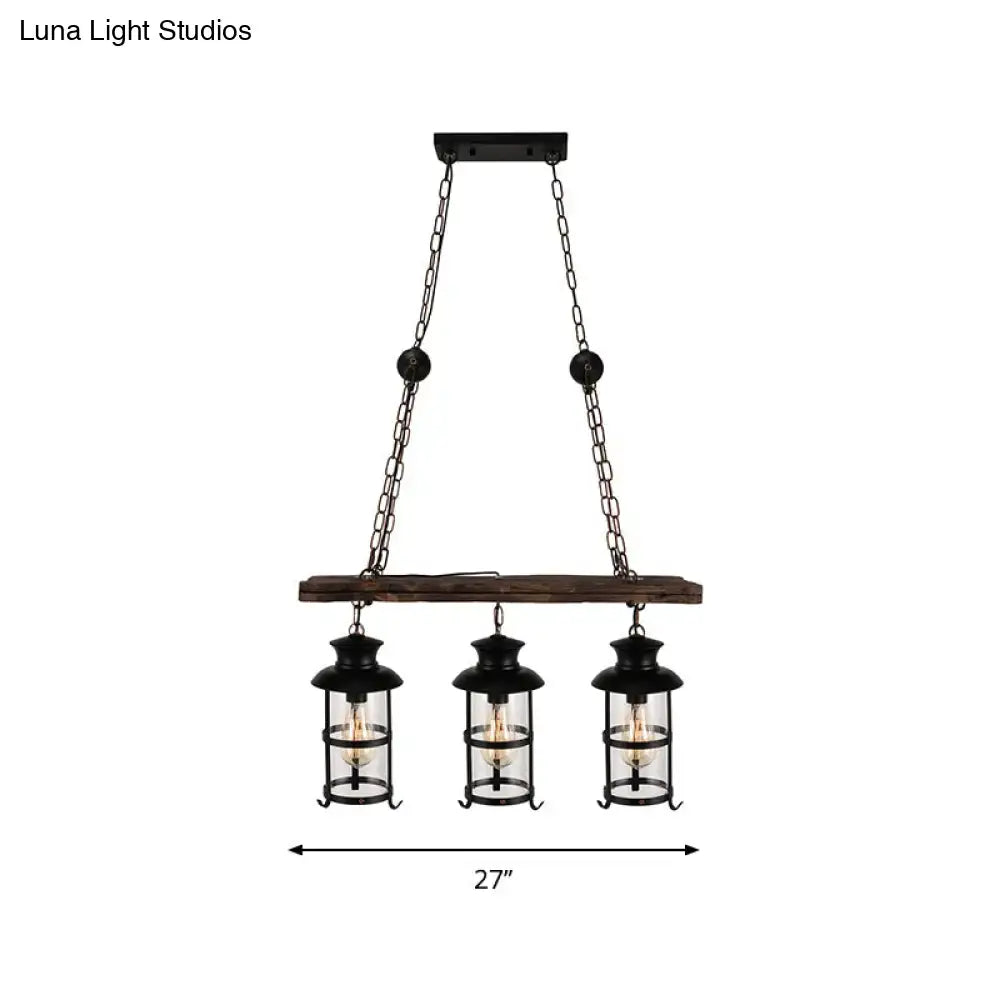 Black metal pendant light with three clear glass bulbs, rustic wooden beam, and cage design by DecorBites™
