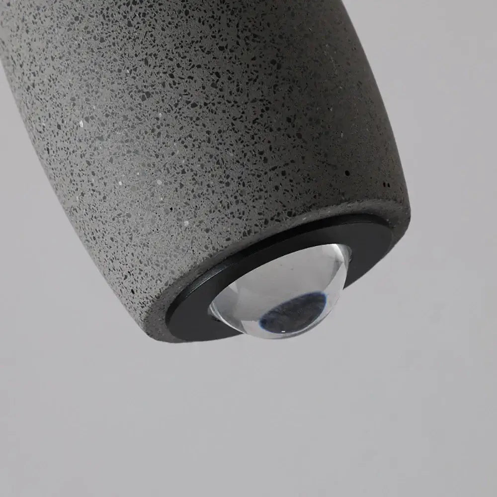 Industrial black matte cement pendant light with speckled dark gray concrete and clear glass globe for bedroom decorbites pendant light