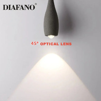 Industrial black matte cement pendant light with gray textured diafano shade and 45° optical lens for focused illumination