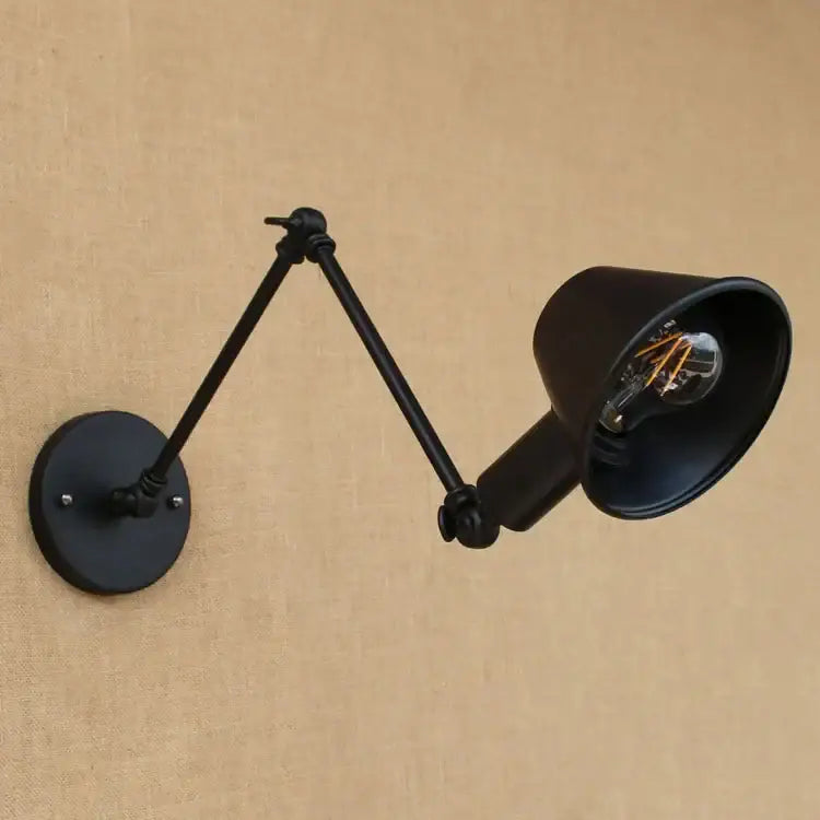Industrial black matte swing arm wall sconce with articulated arms and golden vintage led filament bulb for bedroom decorbites