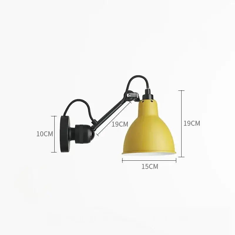Yellow conical metal wall lamp with black articulated arm and mounting bracket for industrial bedroom reading decorbites gras style