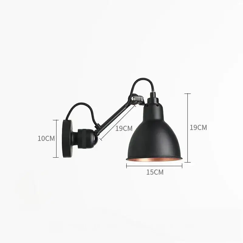 Industrial black matte wall lamp with an adjustable arm and copper-lined interior for bedroom reading light decorbites gras