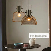 Industrial black mesh cage pendant light with dark metal frame and warm bulb for dining room decorbites cage pendant
