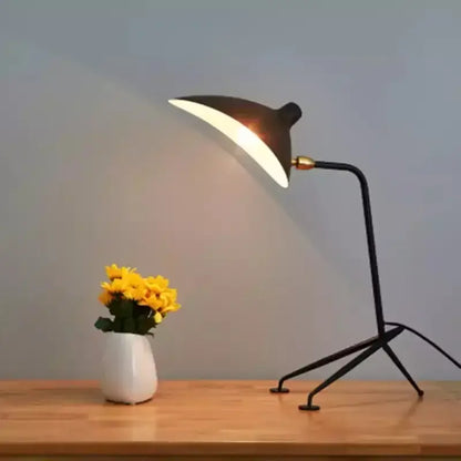 Black metal floor lamp with adjustable arm and gold-toned joint ideal for living room decorbites adjustable arm design