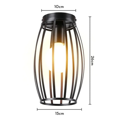Black metal cage ceiling light with vertical bars and warm glowing bulb decorbites industrial led kitchen fixture