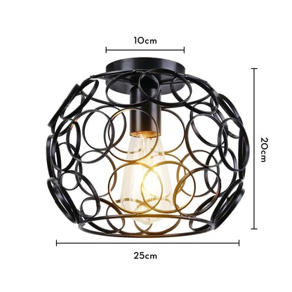 Black wrought iron industrial led ceiling light with spherical cage design and exposed Edison bulb for kitchen decorbites