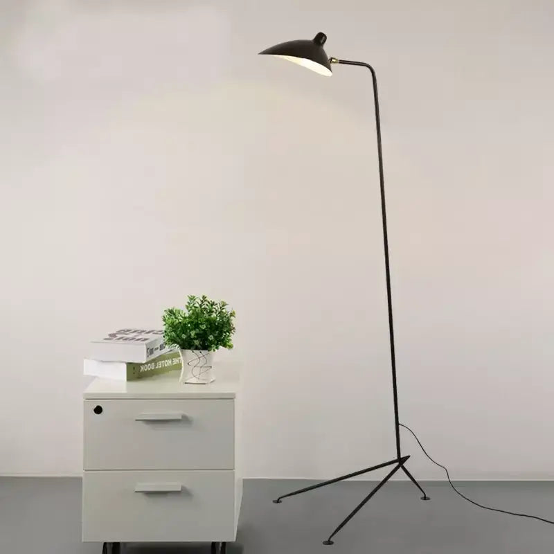 Black metal floor lamp with sleek minimalist design and adjustable head ideal for living room decorbites black serge style