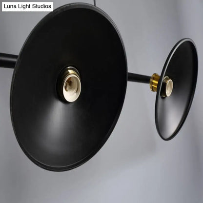 Industrial black metal island pendant with cone shade and brass-colored sockets for dining room lighting