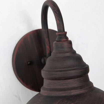Rustic dark bronze farmhouse-style wall lamp with distressed finish and curved arm by decorbites industrial led outdoor
