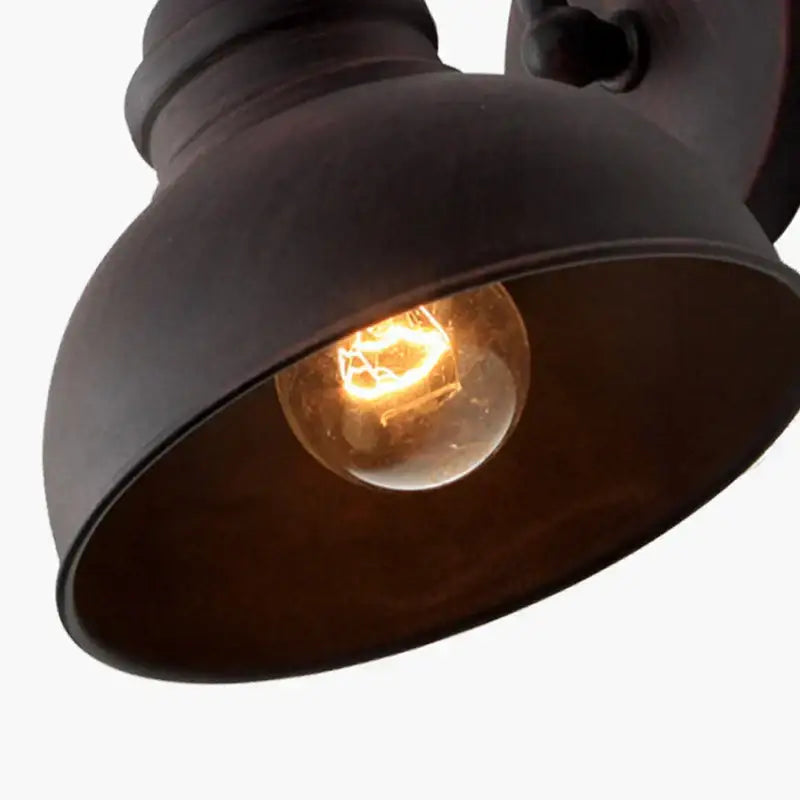 Industrial black metal outdoor wall lamp with warm glowing filament bulb decorbites industrial led wall lamp