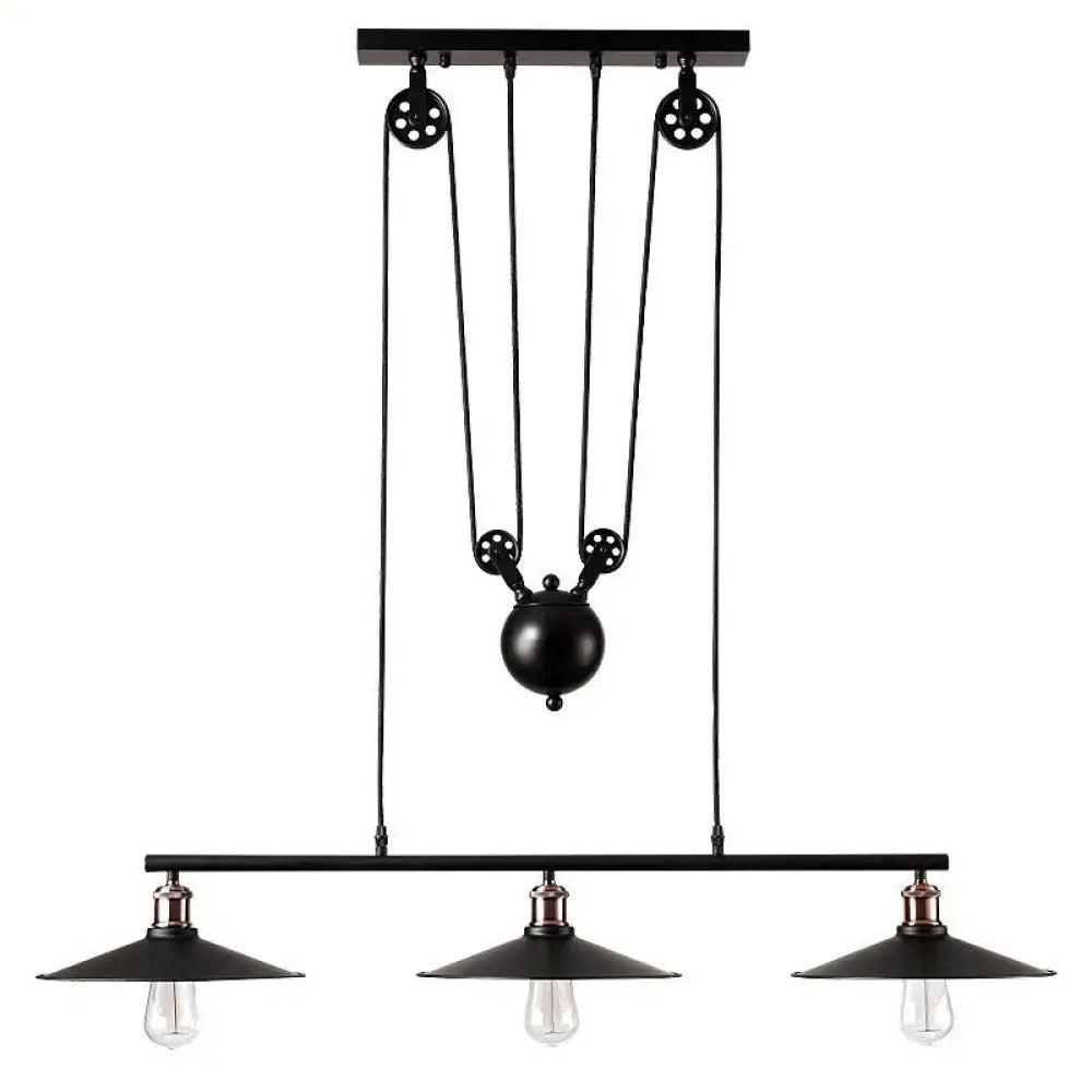 Industrial black metal pulley pendant light with three exposed bulbs and central pulley system for kitchen island use