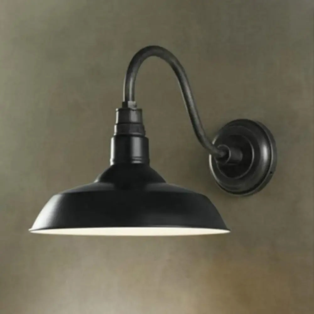 Black wrought iron farmhouse-style wall light with curved arm and metal pot lid shade for led incandescent fluorescent bulbs