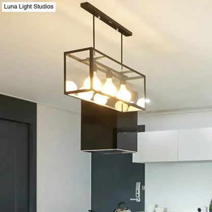 Black rectangular industrial kitchen island pendant light with clear glass panels and exposed bulb fixtures by decorbites