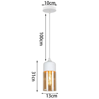A modern industrial pendant light with a white cylindrical top and amber glass shade pendant light for kitchen decor