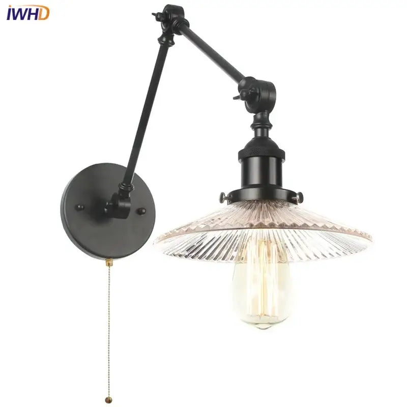 Industrial black wrought iron adjustable wall light fixture with swing arm and faceted glass shade with edison bulb