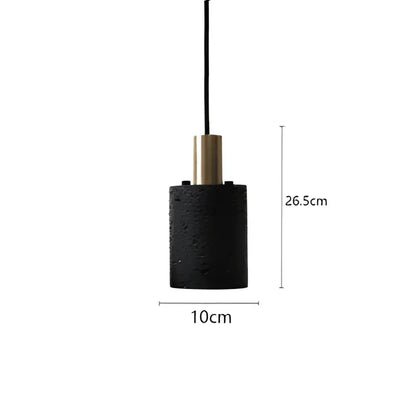 Industrial black travertine cement pendant light with textured black cylindrical shade and gold-toned metallic top