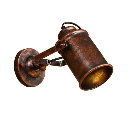 Industrial black vintage wall light with adjustable arm featuring a rustic copper finish and cylindrical shade decorbites industrial vintage