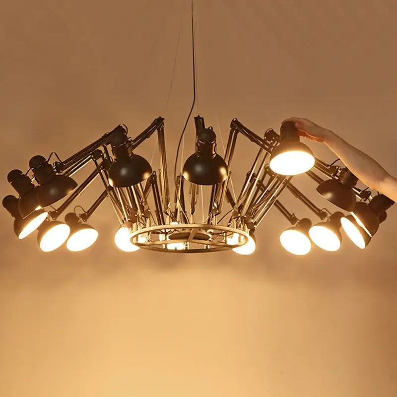 Black industrial style spider ceiling lamp with articulated arms and adjustable lamps for living room use