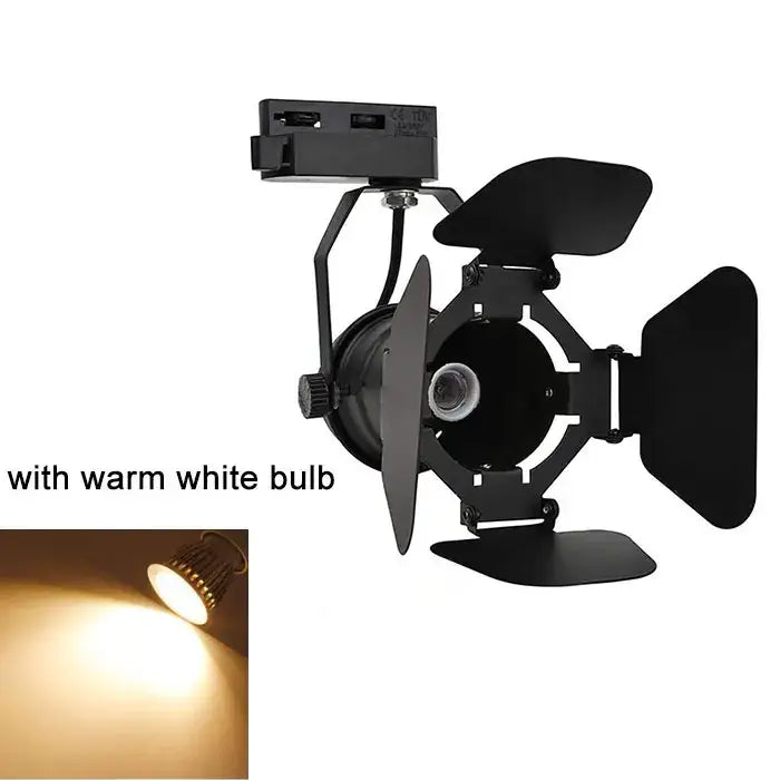 Industrial black metal track spotlight with adjustable barn doors and warm white bulb for office use